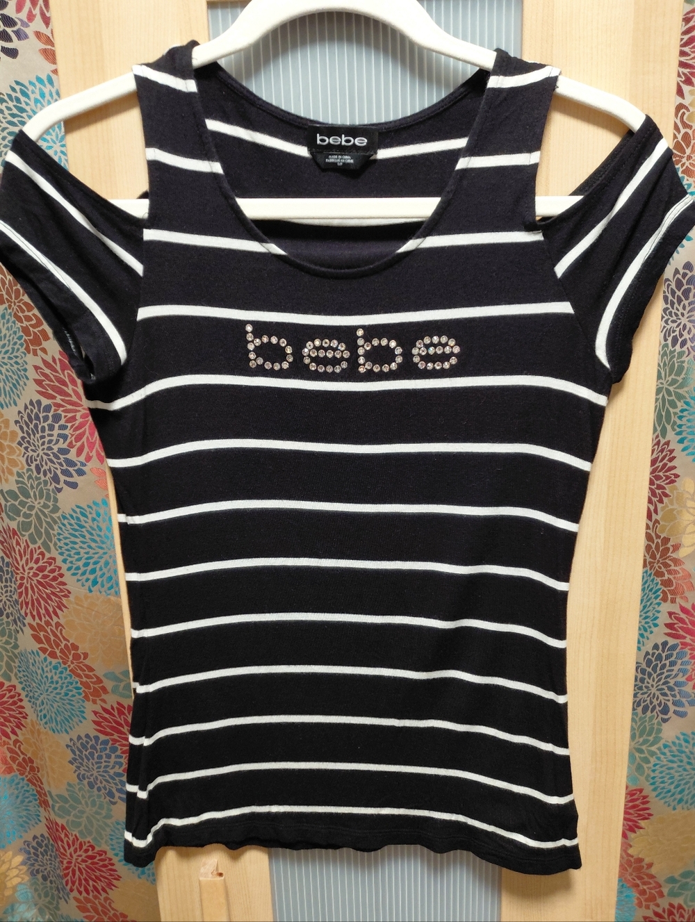 bebe Black & White Striped Open Shoulder Top with Embellished Rhinestone Logo